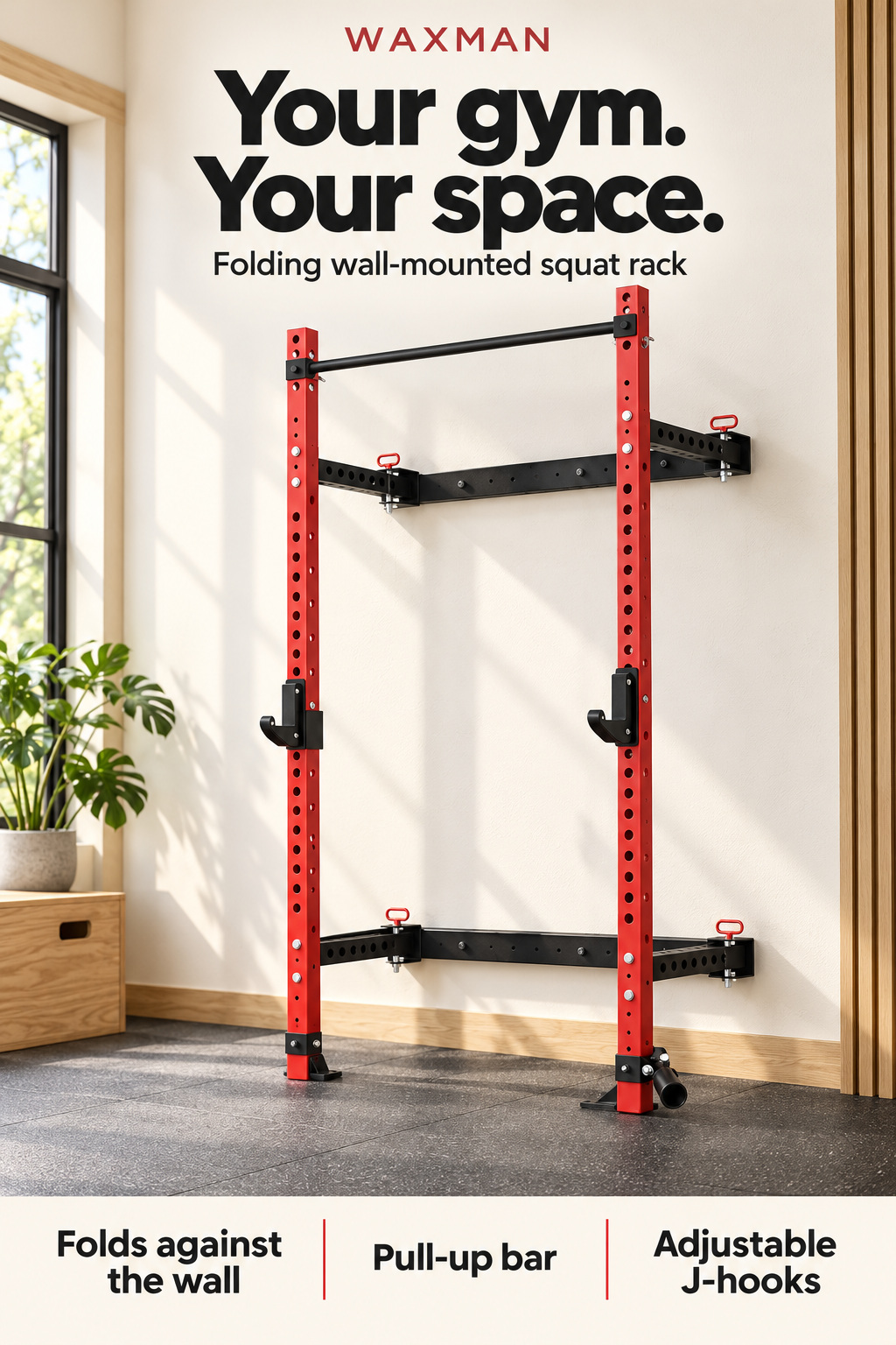 A red and black WAXMAN wall-mounted squat rack in a sunlit home gym with an ivory wall, wood accents and dark rubber flooring. The headline reads “Your gym. Your space.” Three feature labels highlight folding against the wall, a pull-up bar and adjustable J-hooks.